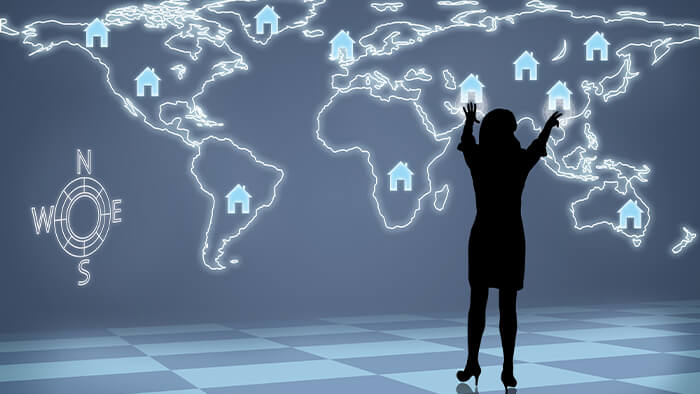 woman pointing to world map CIPS